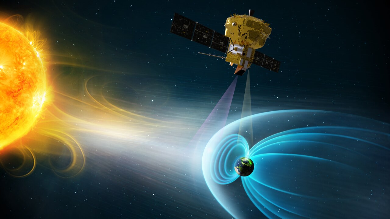 地球の磁気圏を観測する衛星が太陽風を受けながら地球の磁場を測定している様子